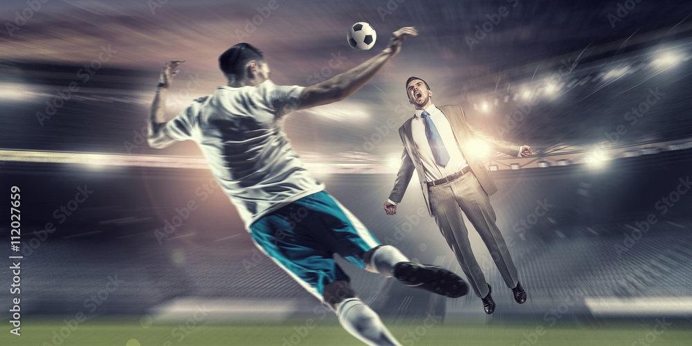 Businessman and player fighting for ball Businessman and player fighting for ball