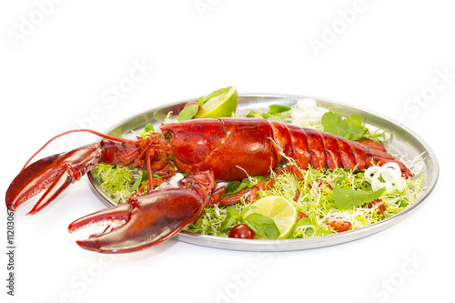 lobster with fresh herbs and lemon on a white background