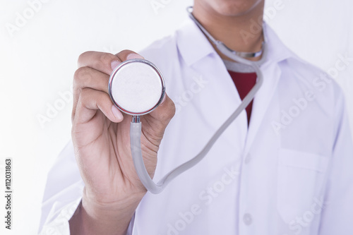 Hand holding stethetoscope on white background