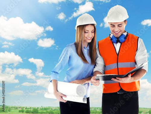 Two architects at work on b...