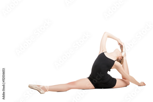 Blonde woman in split bending back