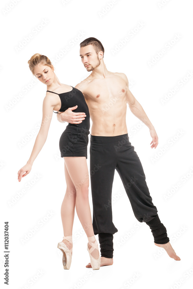 Couple in black posing against of white background Couple in black posing against of white background