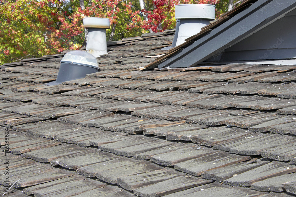 © sheilaf2002 - Wood shake shingle roof more then 30 years old decaying and falling apart. Exceeded life expectancy and needs to be replaced.