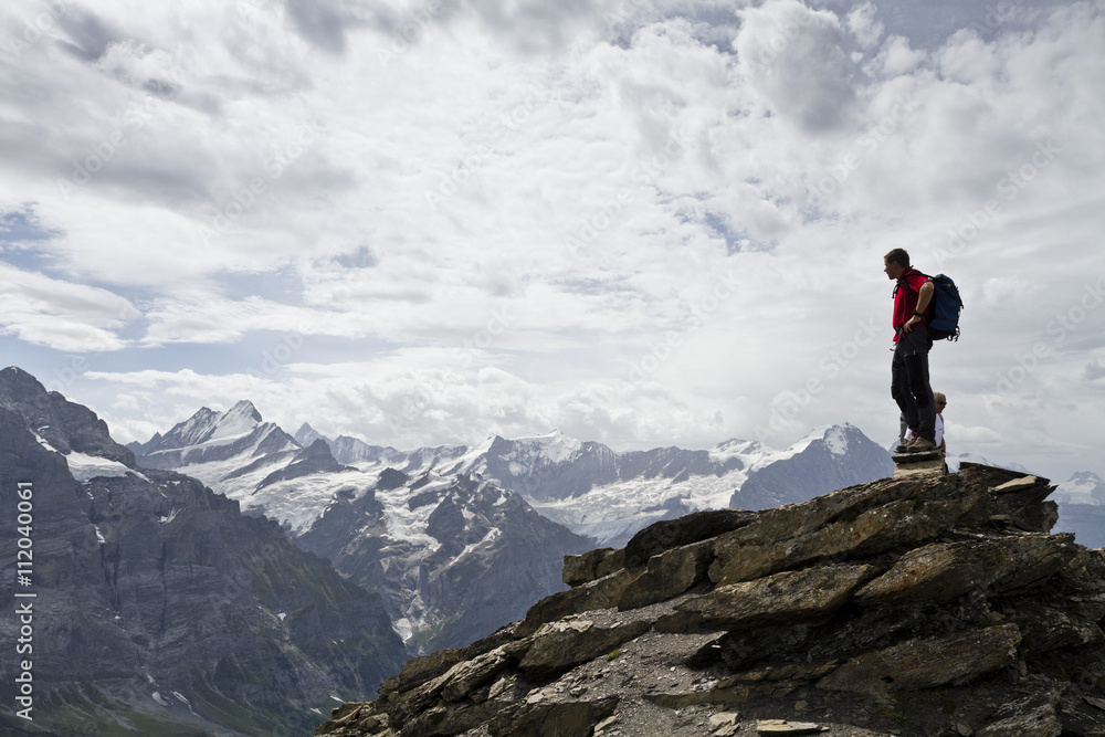 Man standing on top of mountain Man standing on top of mountain