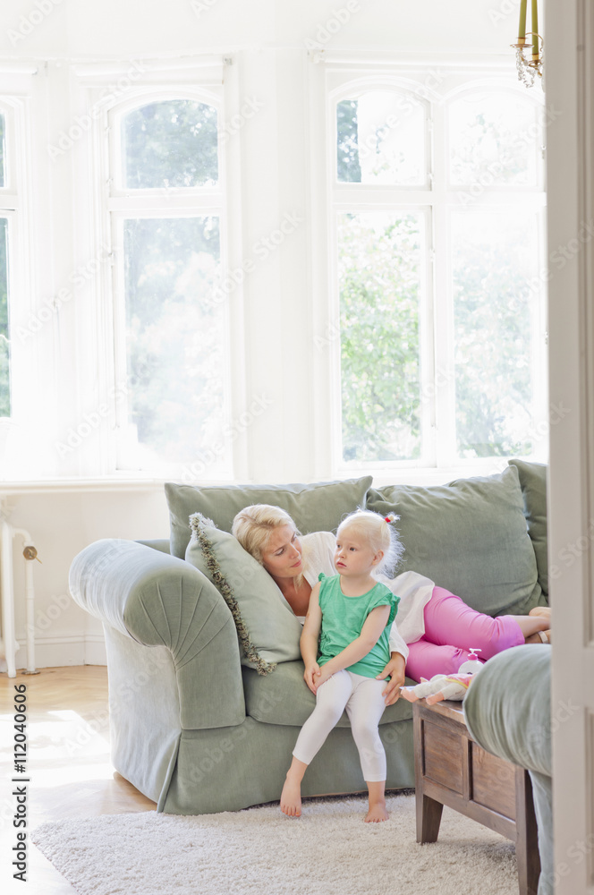 Mother with daughter on sofa Mother with daughter on sofa