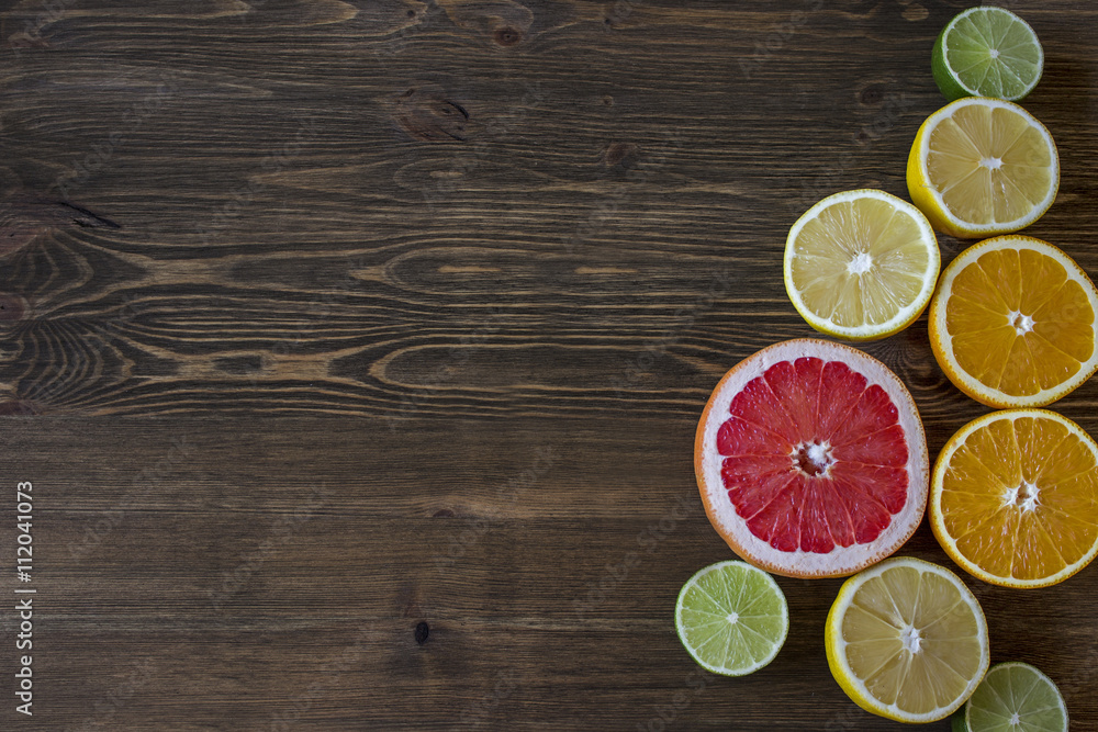 Citrus fruits. Over wood table background Citrus fruits. Over wood table background