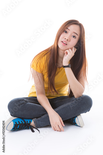 Young Asian student isolated on white background.