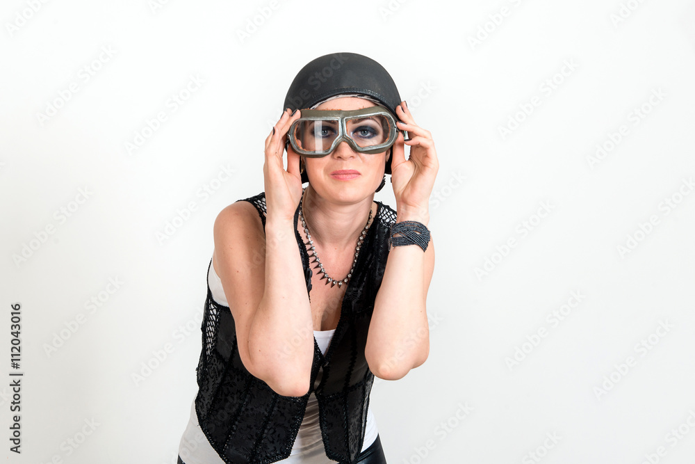 Fashion portrait of sexy stunning hipster woman, bright make up, vintage sunglasses, biker leather jacket, trendy jewelry and accessorizes. Urban wall background. Photoshoot relaxed biker Fashion portrait of sexy stunning hipster woman, bright make up, vintage sunglasses, biker leather jacket, trendy jewelry and accessorizes. Urban wall background. Photoshoot relaxed biker