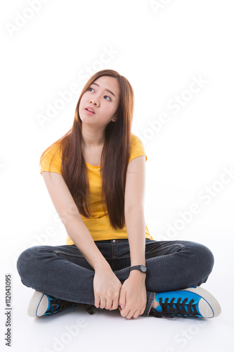 Young Asian student isolated on white background.