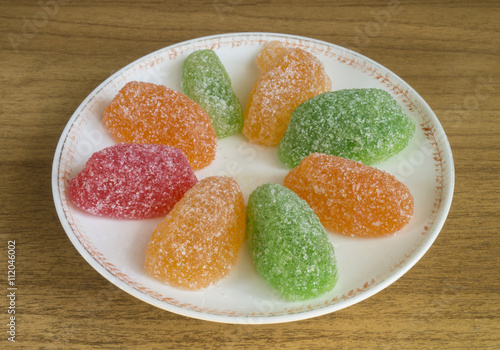 Sweet fruit jellies on plate