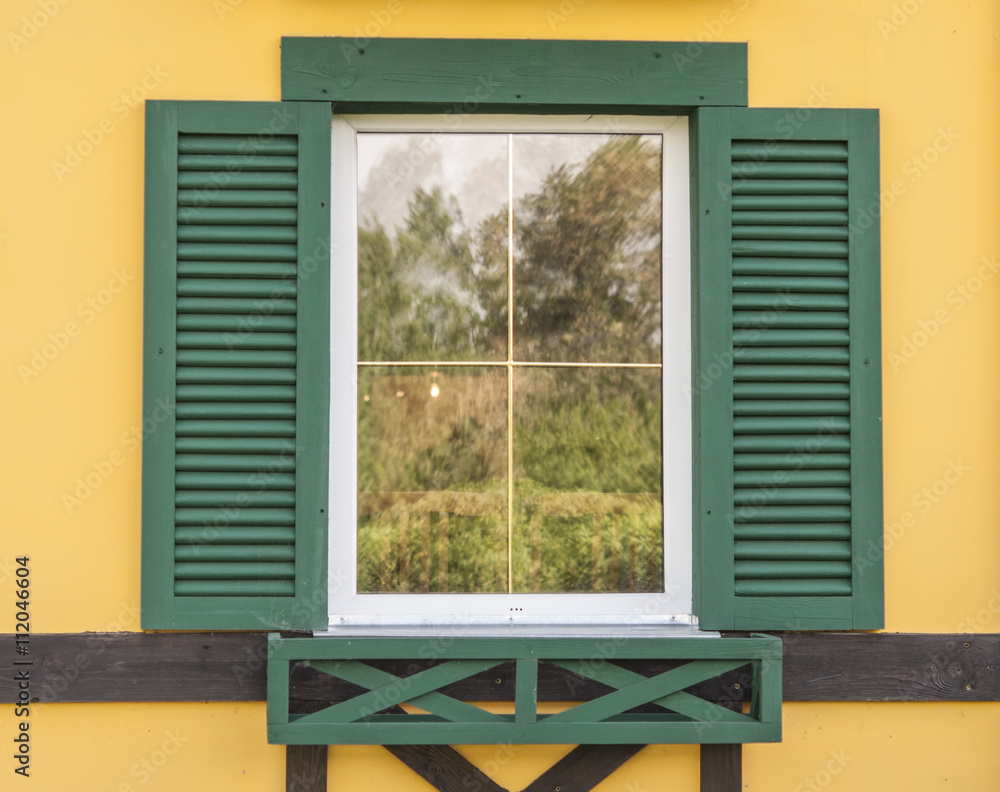 Obraz premium Window with open wooden shutters