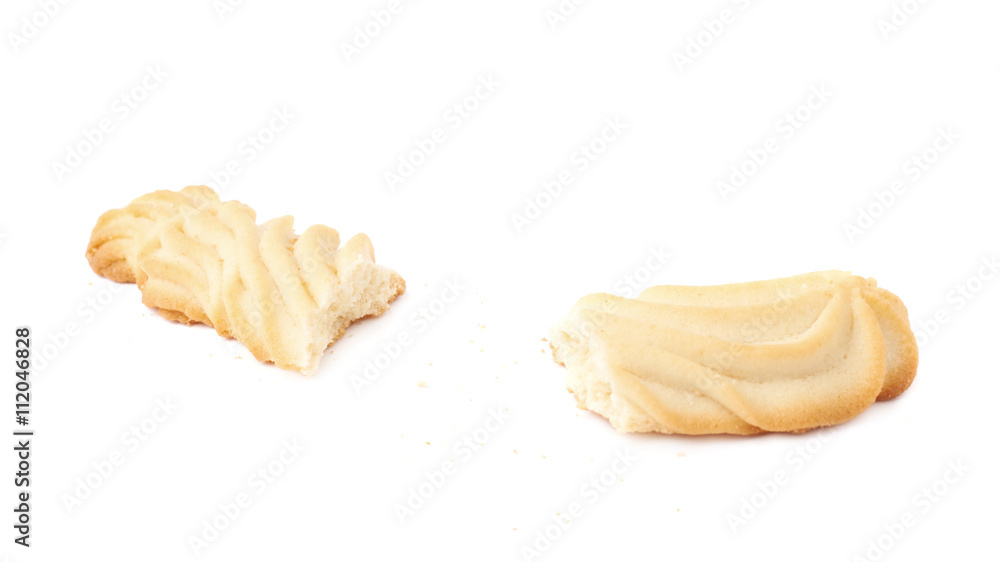 Broken into pieces cookie isolated over the white background Broken into pieces cookie isolated over the white background