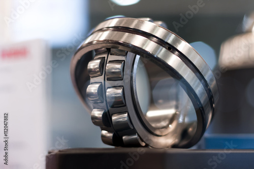 Cylindrical bearing with bokeh background photo