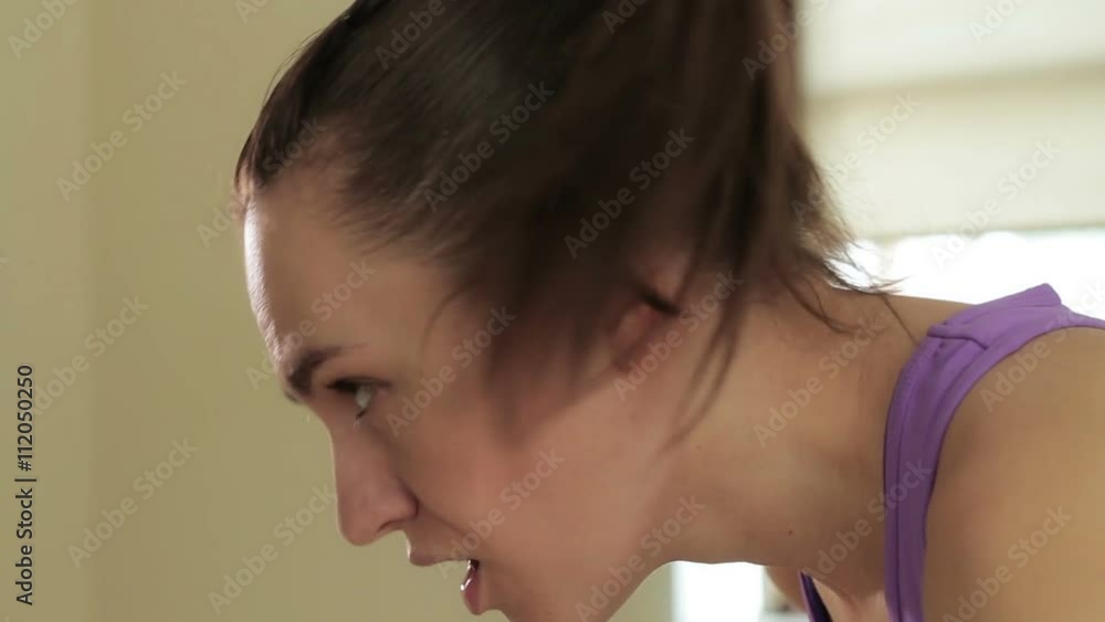 Portrait of tired brunette having rest in short break after workout Portrait of tired brunette having rest in short break after workout