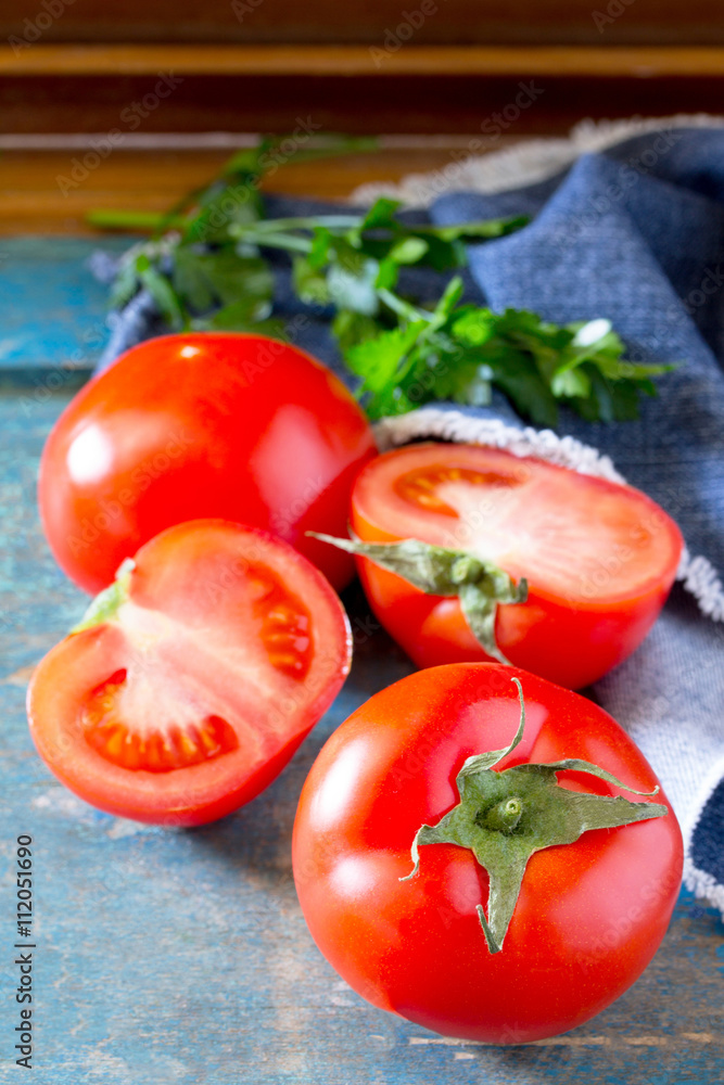 Fresh organic tomatoes on a wooden table, selective focus. Fresh organic tomatoes on a wooden table, selective focus.