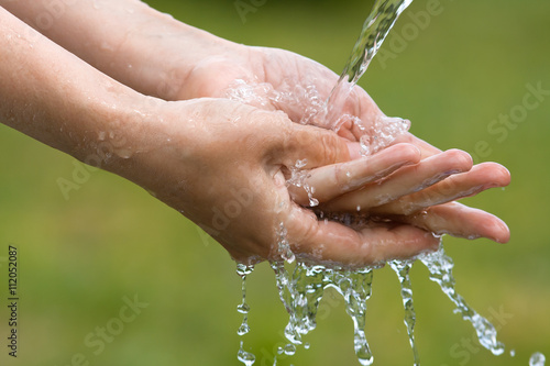 closeup of woman washing her hands