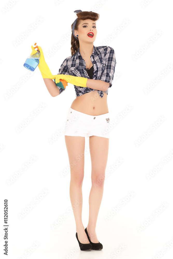 Young woman with spray bottle and sponge. Young woman with spray bottle and sponge.
