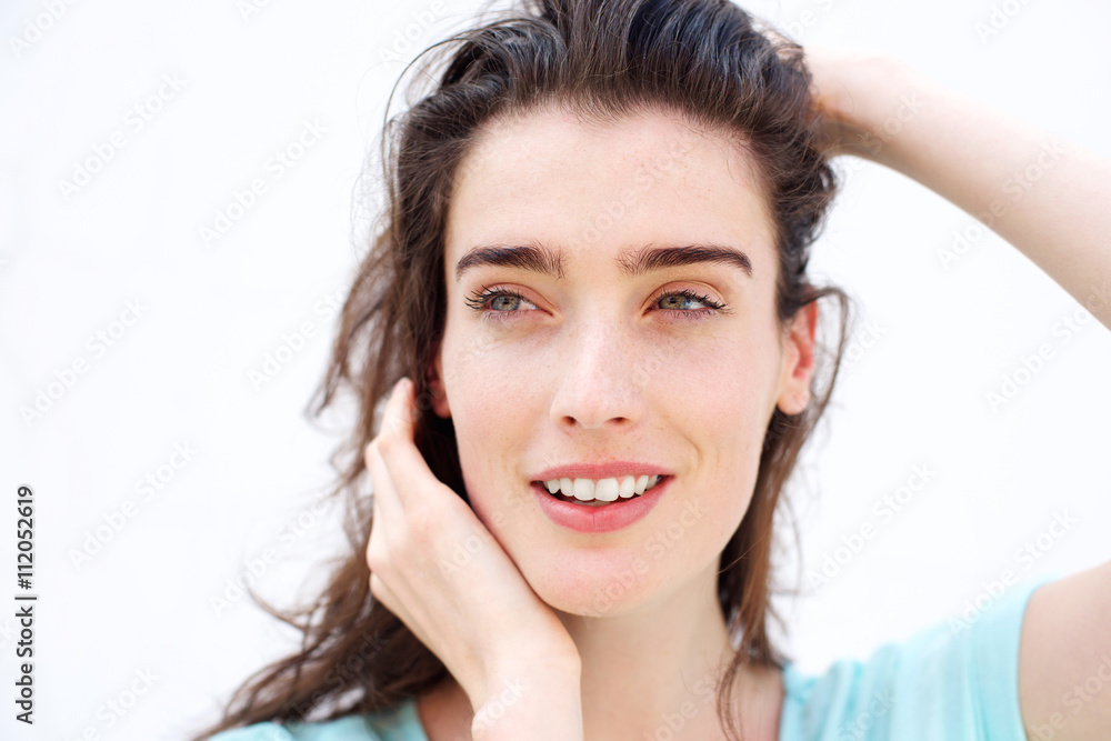 Beautiful smiling woman with hands in hair Beautiful smiling woman with hands in hair