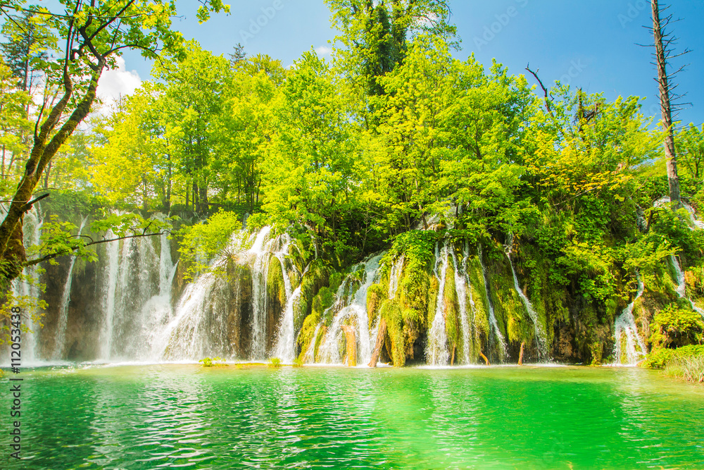 Naklejka premium Beautiful landscape, waterfall and clear green water in the Plitvice Lakes National Park in Croatia. Beautiful world. 