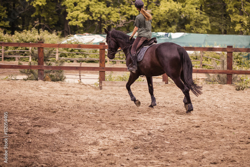 girl sportsman rides on horse © Olexandr