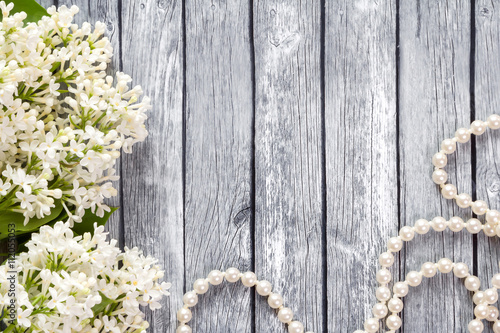 White flowers on a wooden background.