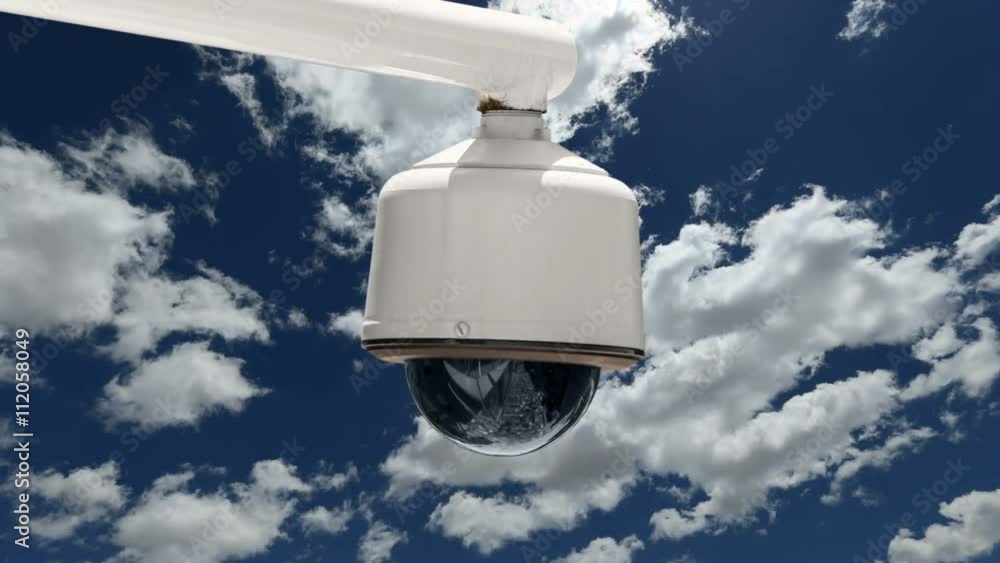 Overhead security camera with time lapse clouds and zoom in. Overhead security camera with time lapse clouds and zoom in.