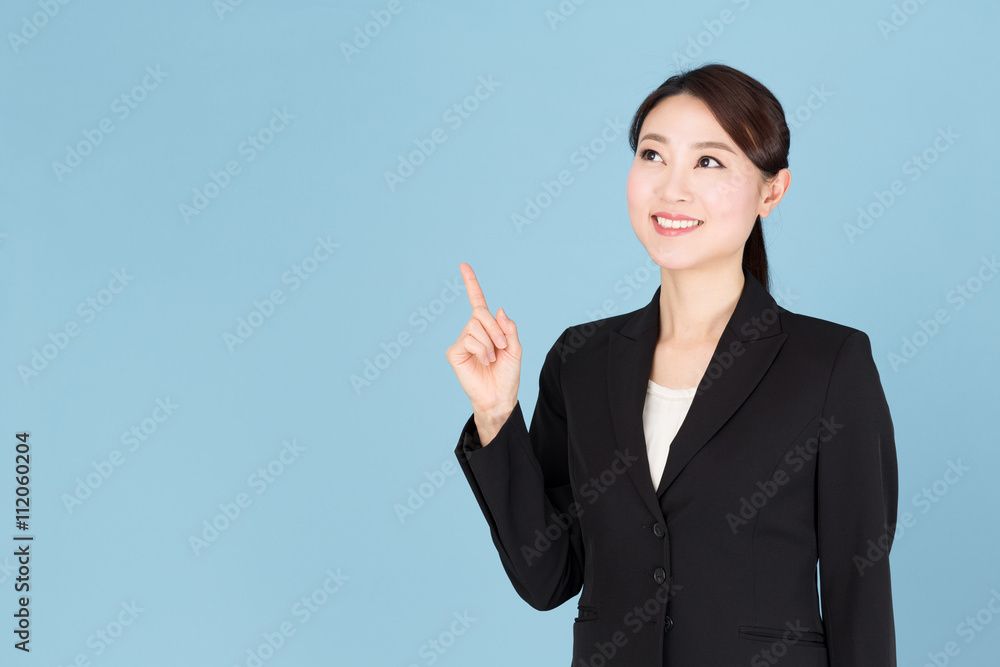 portrait of asian businesswoman isolated on blue background portrait of asian businesswoman isolated on blue background