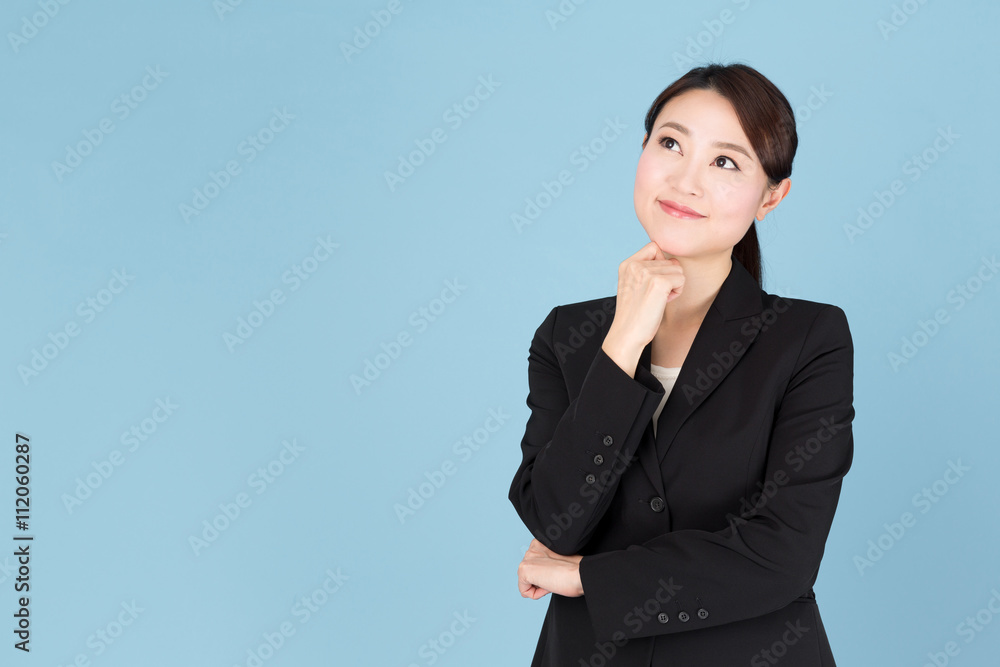 portrait of asian businesswoman isolated on blue background portrait of asian businesswoman isolated on blue background