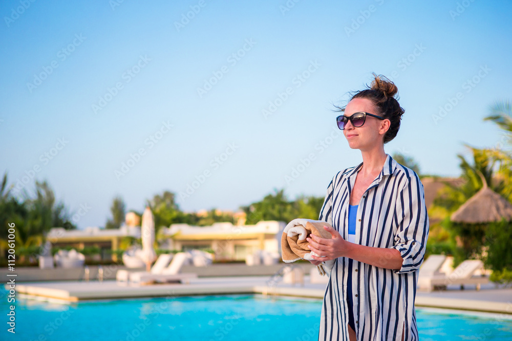 Happy woman relaxing outdoors on vacation
