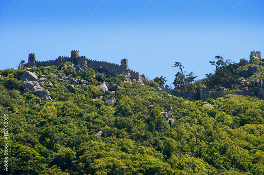 Sintra is a resort town in the foothills of Portugals Sintra Mountains, near the capital of Lisbon. A longtime royal sanctuary, its forested terrain is studded with pastel-colored villas and palaces. 