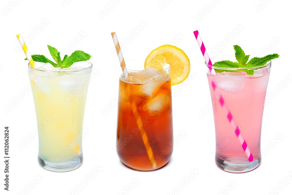 Three glasses of summer lemonade, iced tea, and pink lemonade drinks with straws isolated on a white background Three glasses of summer lemonade, iced tea, and pink lemonade drinks with straws isolated on a white background