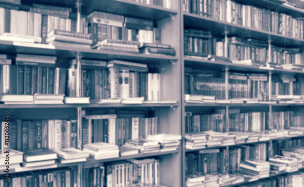 blurred bookshelf in library for your background design blurred bookshelf in library for your background design