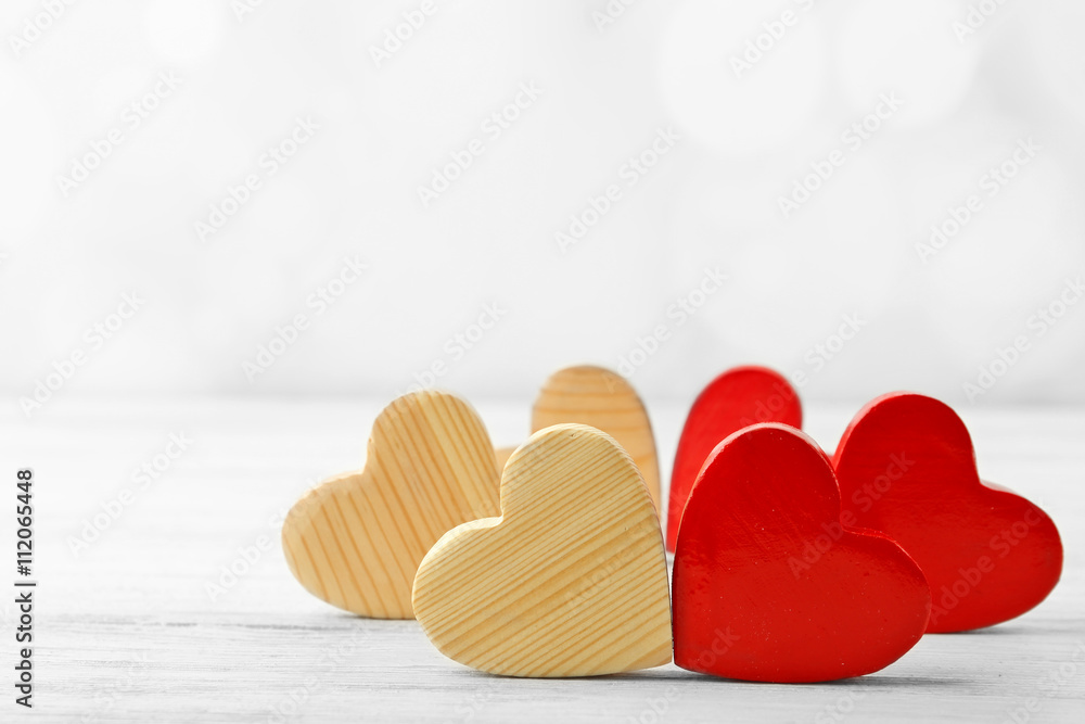 Wooden hearts on light background Wooden hearts on light background