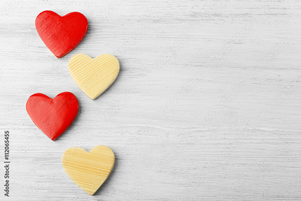 Wooden hearts on light background Wooden hearts on light background