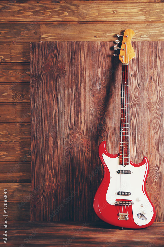 Fototapeta premium Electric guitar on wooden background