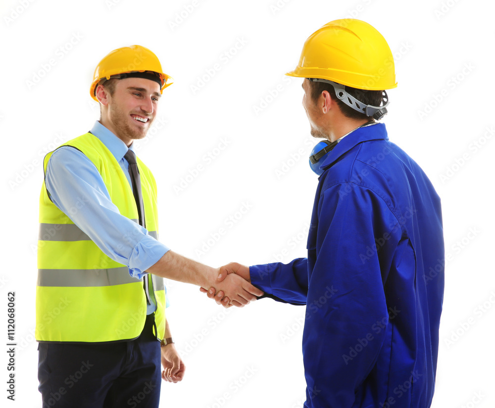 Two engineers shaking hands isolated on white Two engineers shaking hands isolated on white
