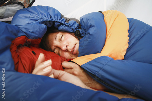 Woman sleeping in sleeping bag