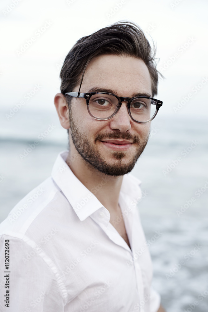 Mid adult man looking at camera