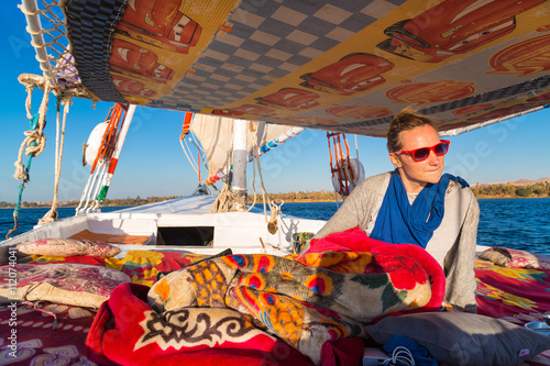 EGYPT -  FEBRUARY 8, 2016: Tourist enjoying felucca trip on the Nile.