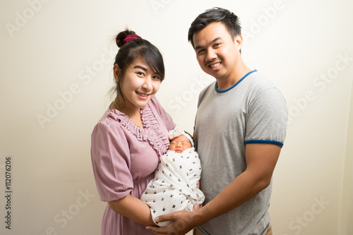 Wallpaper Mural Portrait of Asian parents and six months old baby girl at home. Torontodigital.ca