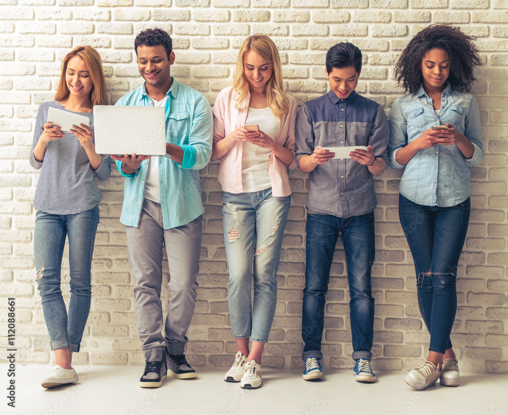 Fototapeta premium Young people with gadgets