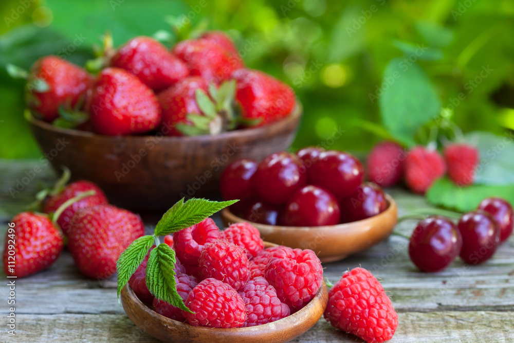 Fresh strawberries, raspberries and sour cherries from the garden Fresh strawberries, raspberries and sour cherries from the garden