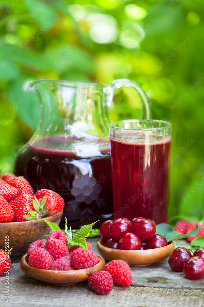Healthy juice made from organic strawberries, cherries and raspberries Healthy juice made from organic strawberries, cherries and raspberries