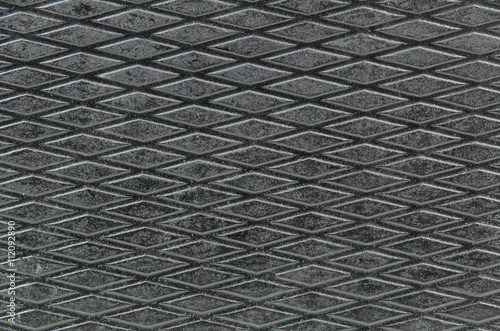 closeup of the diamond shaped pattern on a surface of the music mixer case