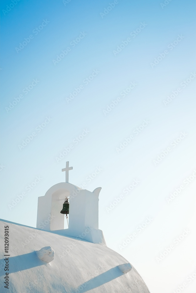 White church against blue sky in Santorini island, Oia, Greece