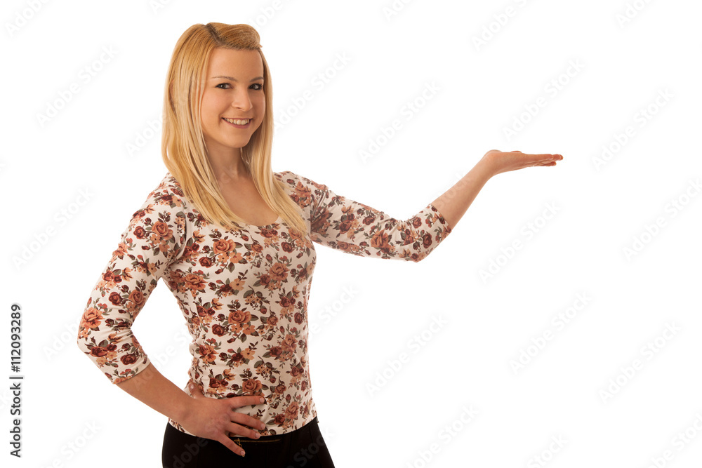 Cute blond woman pointing into copy space as she is showing a pr Cute blond woman pointing into copy space as she is showing a pr