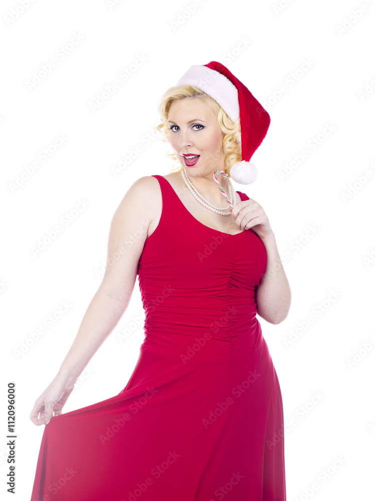 woman playing with dress while eating candy cane woman playing with dress while eating candy cane