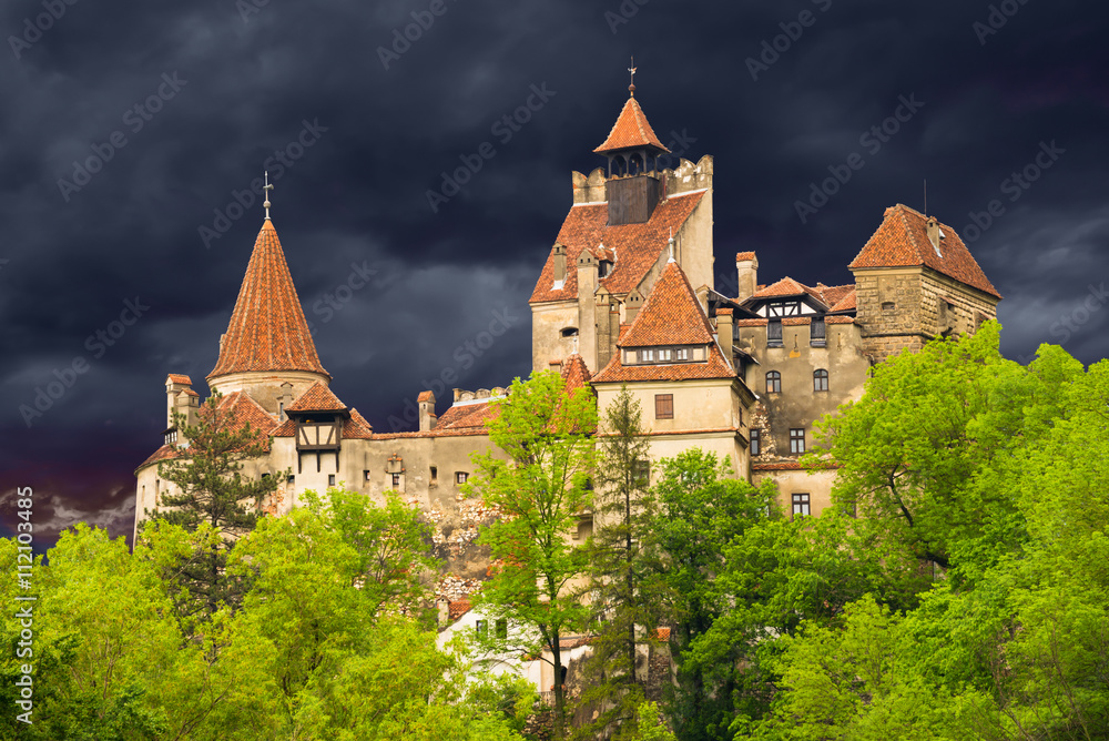 Mediaeval Dracula castle against dramatic sky in Bran town, in Romania Mediaeval Dracula castle against dramatic sky in Bran town, in Romania