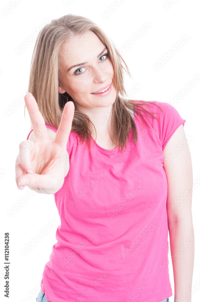 Close-up portrait of joyful woman showing victory sign Close-up portrait of joyful woman showing victory sign