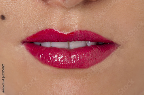 a woman's lips with pink lipstick